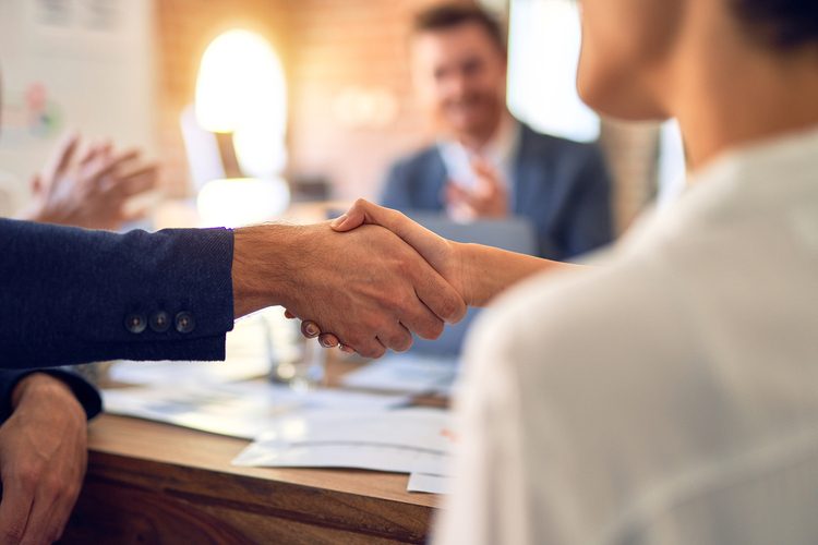 conference table handshake